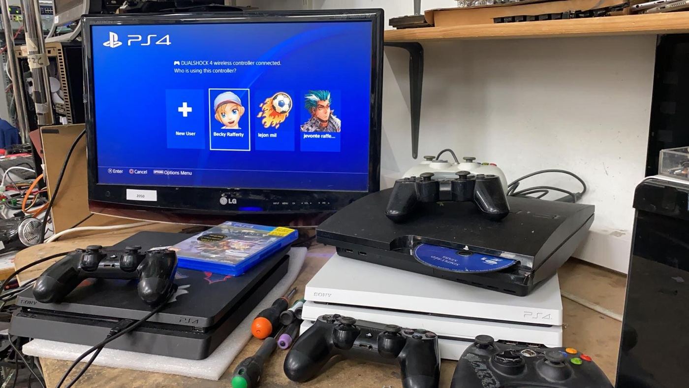 PlayStation consoles and controllers being tested on the bench
