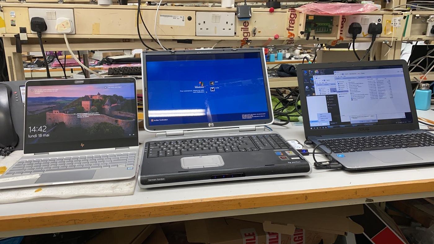 Three laptops running on the test bench
